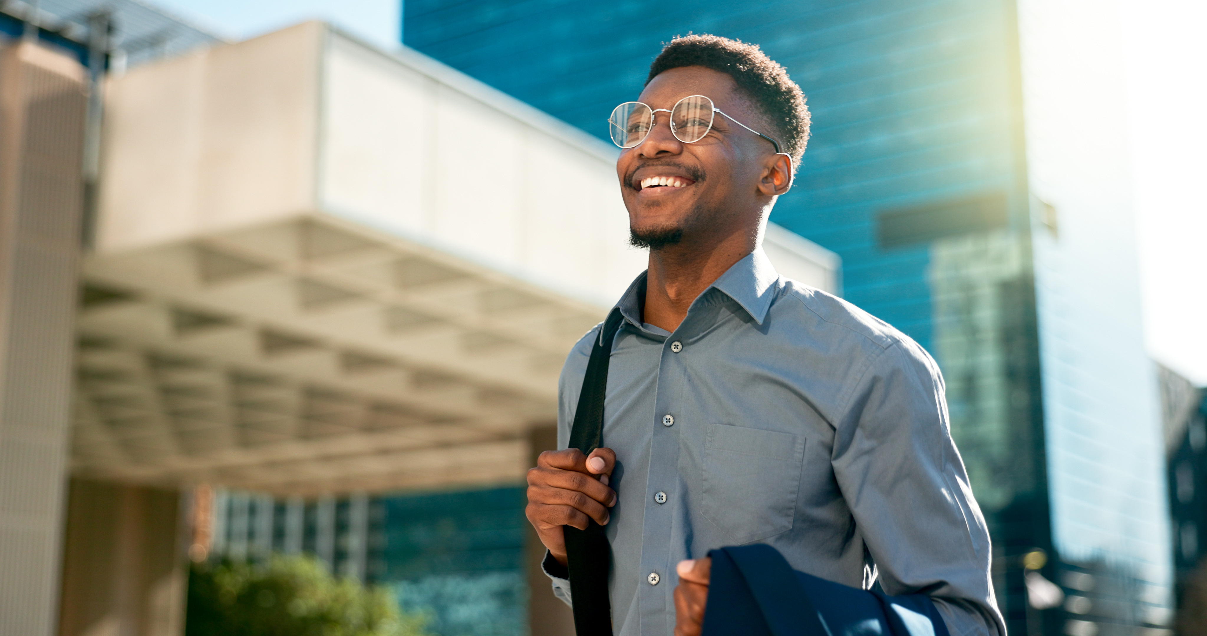 Professional man smiling in an urban setting